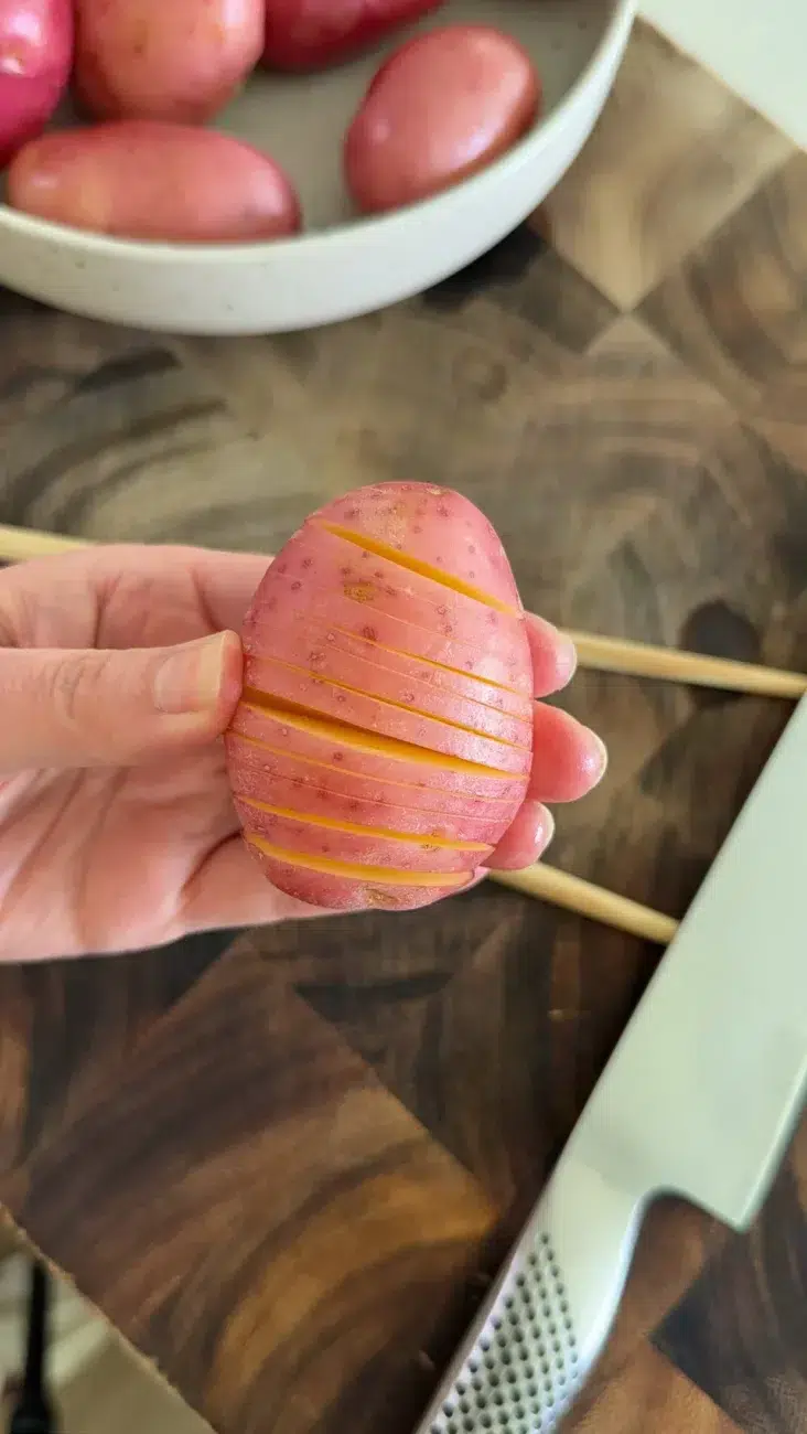 Hasselback Potato sliced and ready to cook