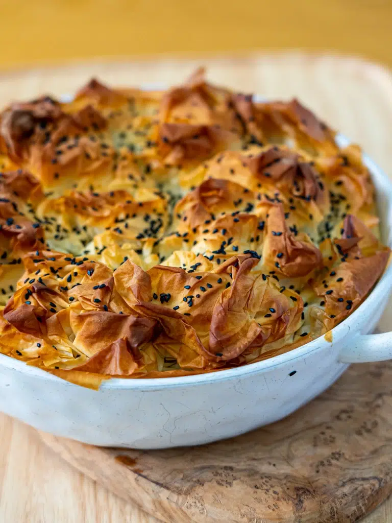 Close-up of spanakopita with crunchy, golden-brown pastry