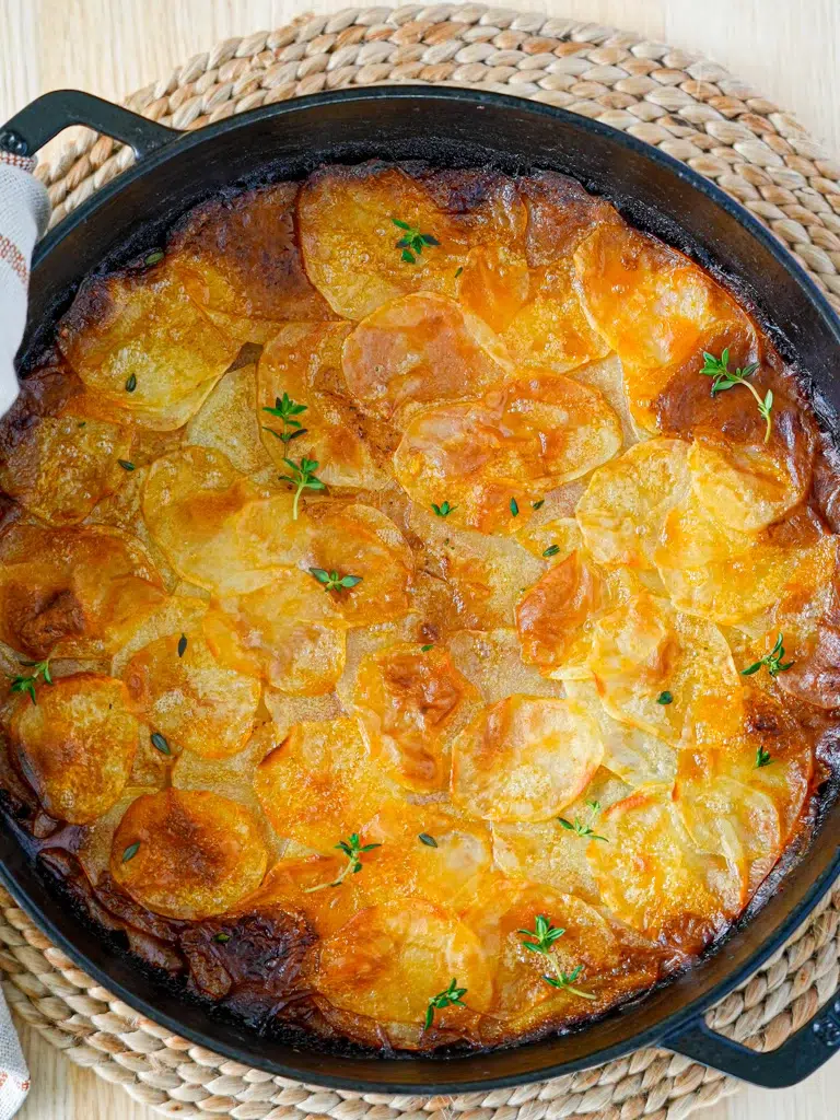 Full beef and potato pie in one pan, with a golden flaky crust.