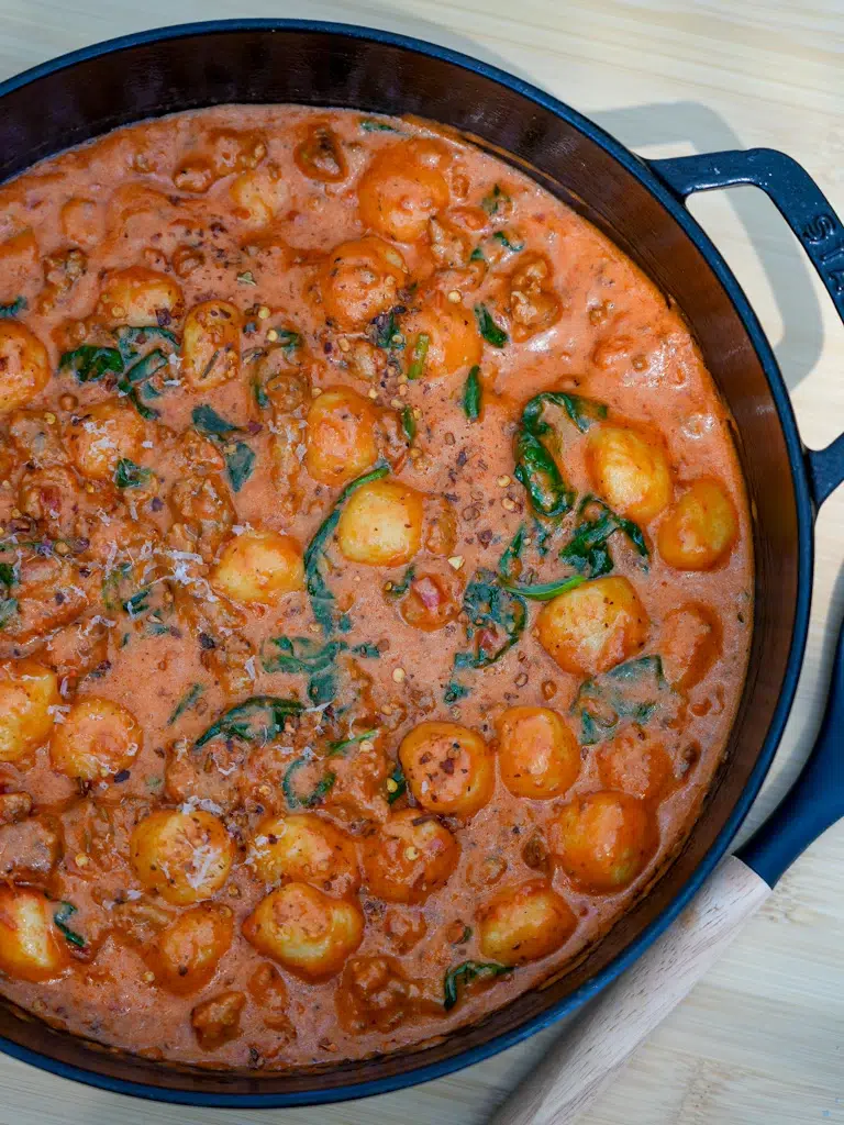 One-Pan Creamy Sausage Gnocchi served in a cast-iron skillet