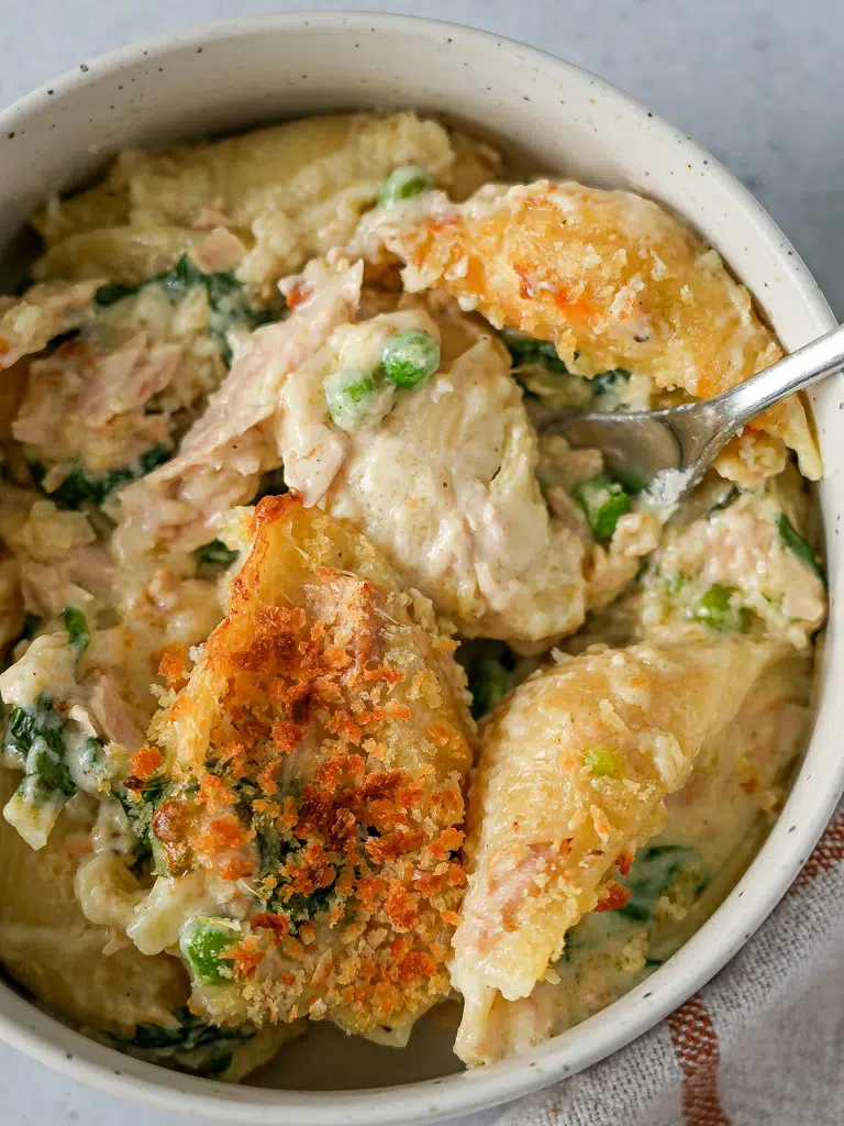 Overhead view of a Supercharged Tuna Mornay Pasta Bake served in a white bowl.