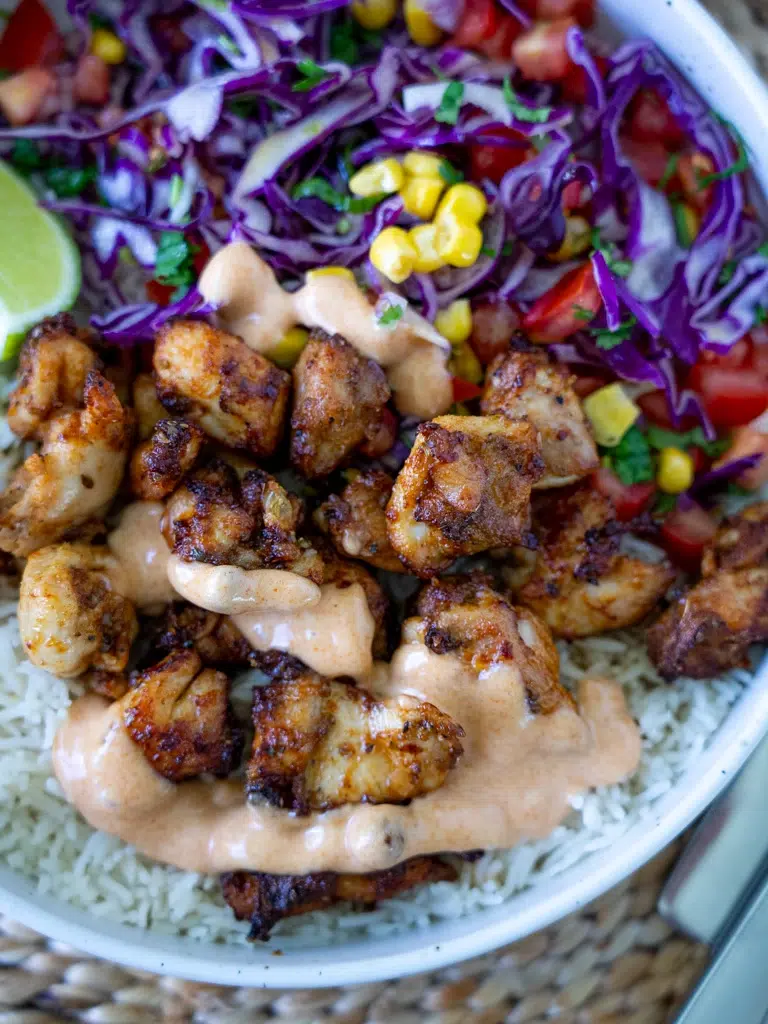 Close-up angled shot of Peri Peri chicken highlighting the texture and seasoning