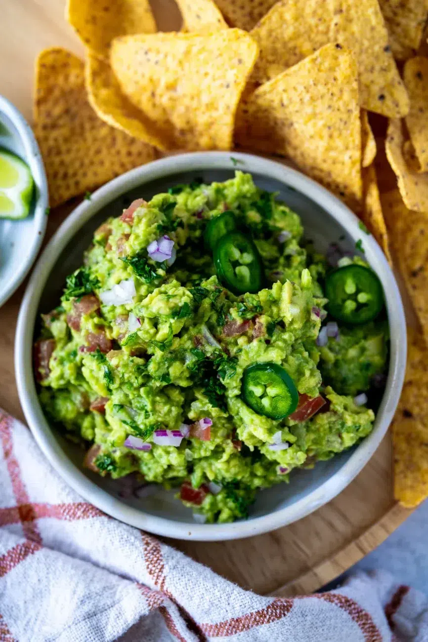 Guacamole Recipe with corn chips and jalapenos