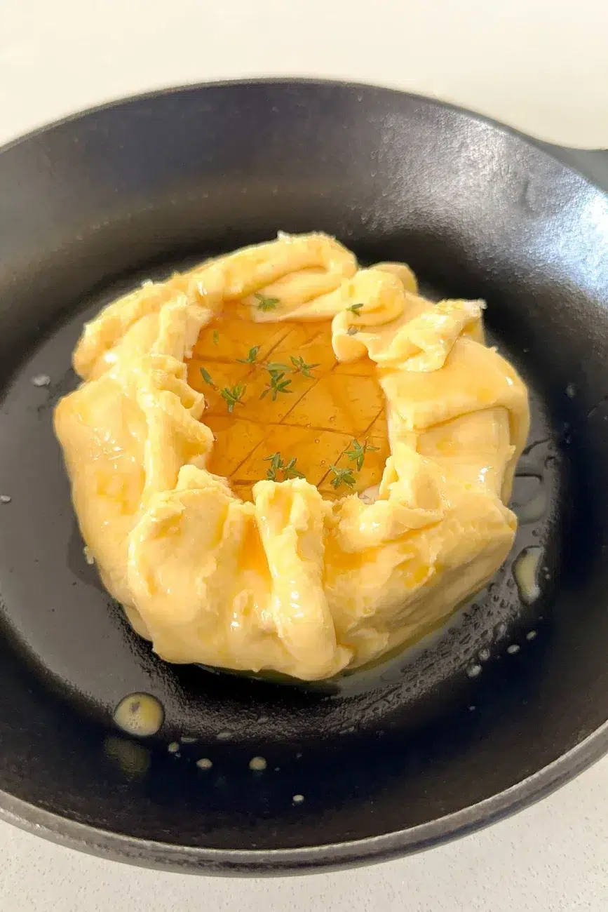 Brie in pastry, egg wash, topped with honey and thyme