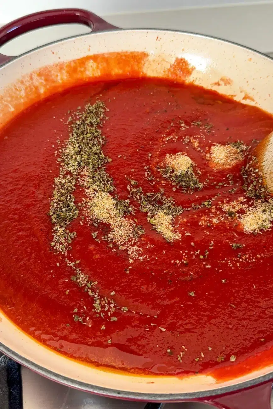 ingredients added to passata ready to be stirred in